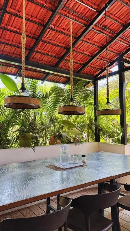 Open-air restaurant at The Seascape with handwoven pendant lamps
