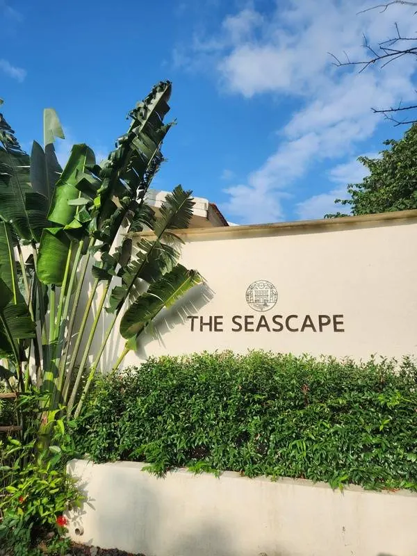The Seascape entrance sign among tropical greenery at Korlai, Alibag